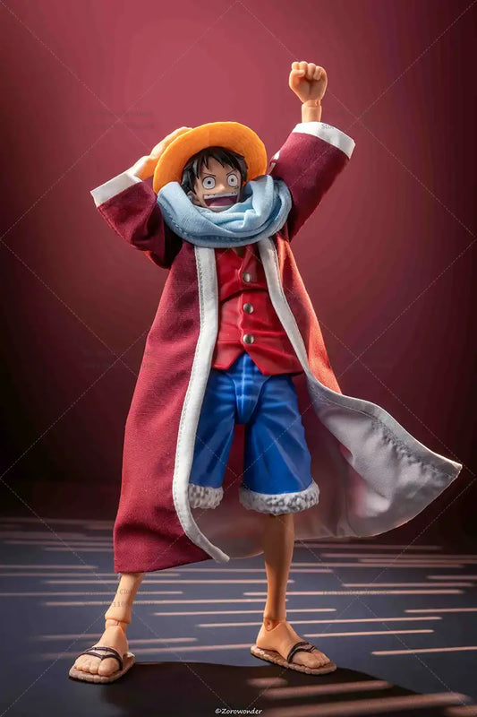 Action figure of a character in a red coat and yellow hat against a dark background