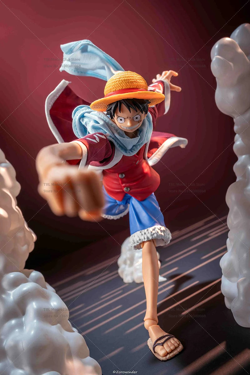 Action figure of a character from an anime with a red jacket and yellow hat, pointing forward.