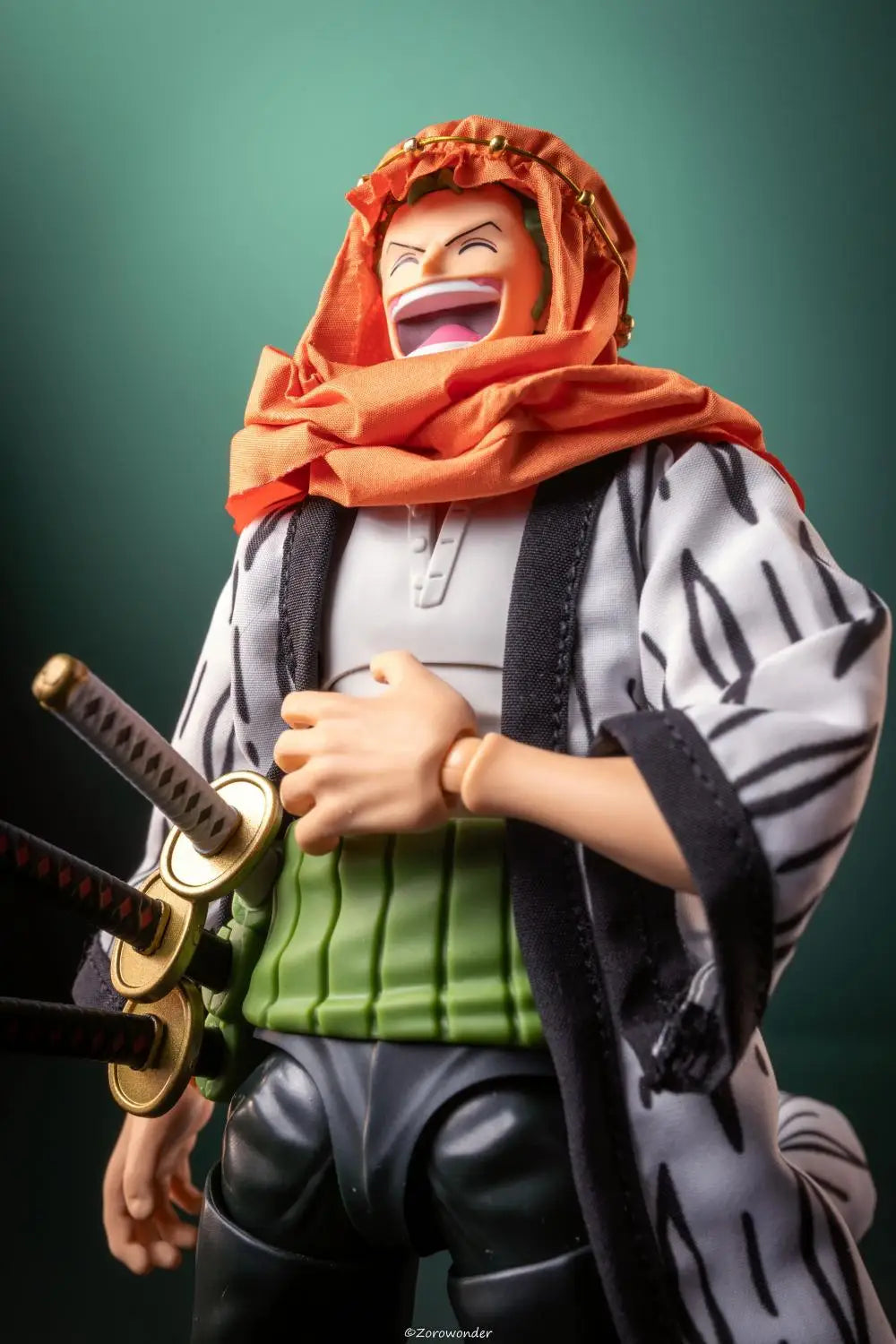 Action figure with an orange headscarf and swords on a dark background