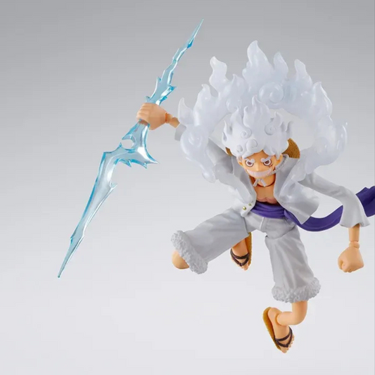 Action figure with white hair and a blue weapon on a gray background