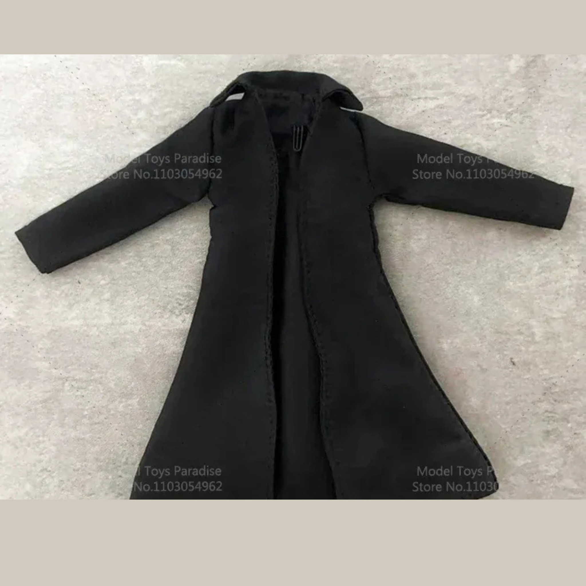 Black coat on a textured gray background