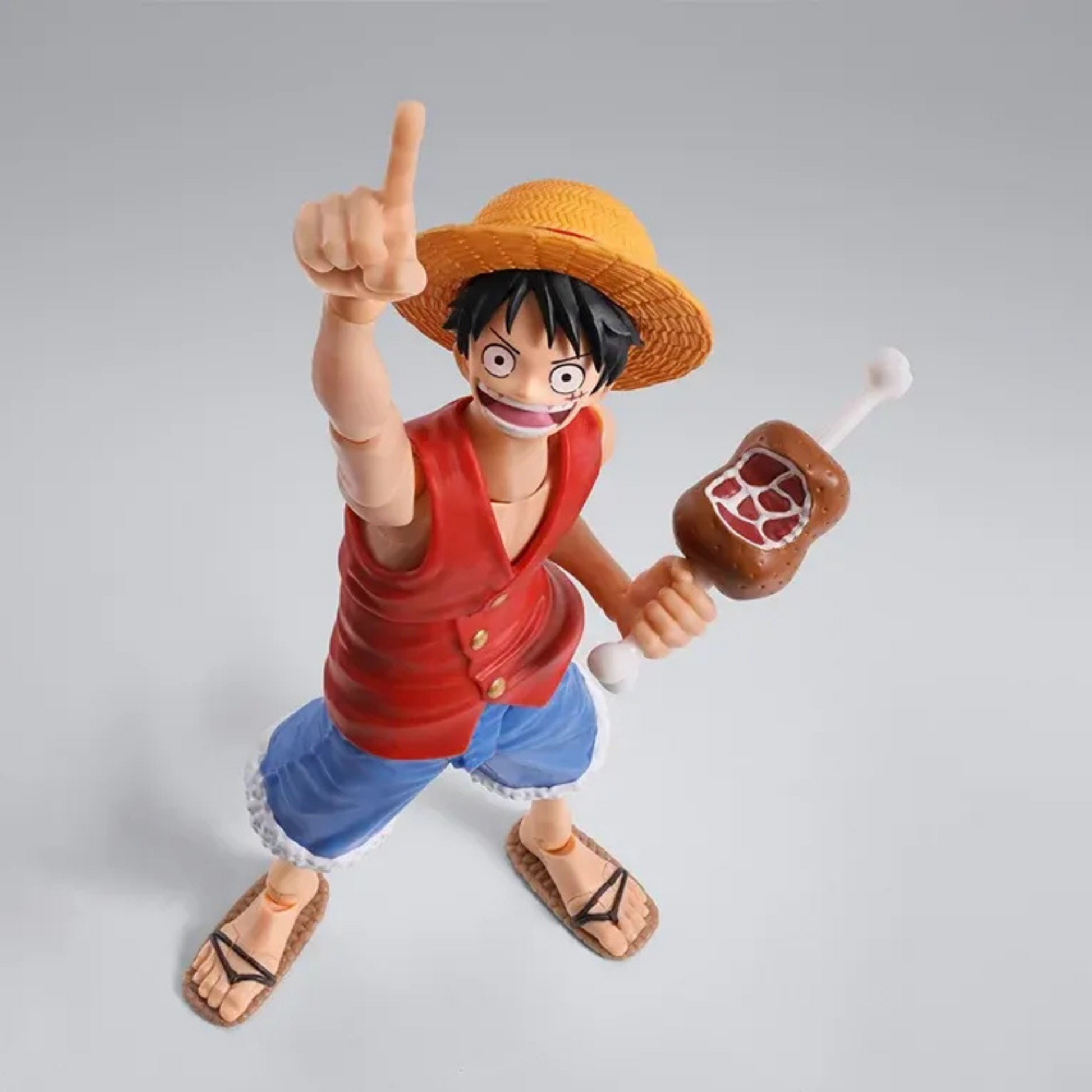 Action figure of a character from an anime series on a gray background