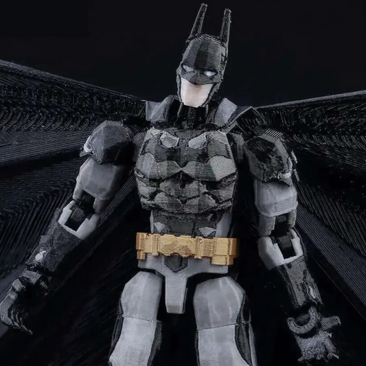 Batman action figure on a reflective surface with a dark background