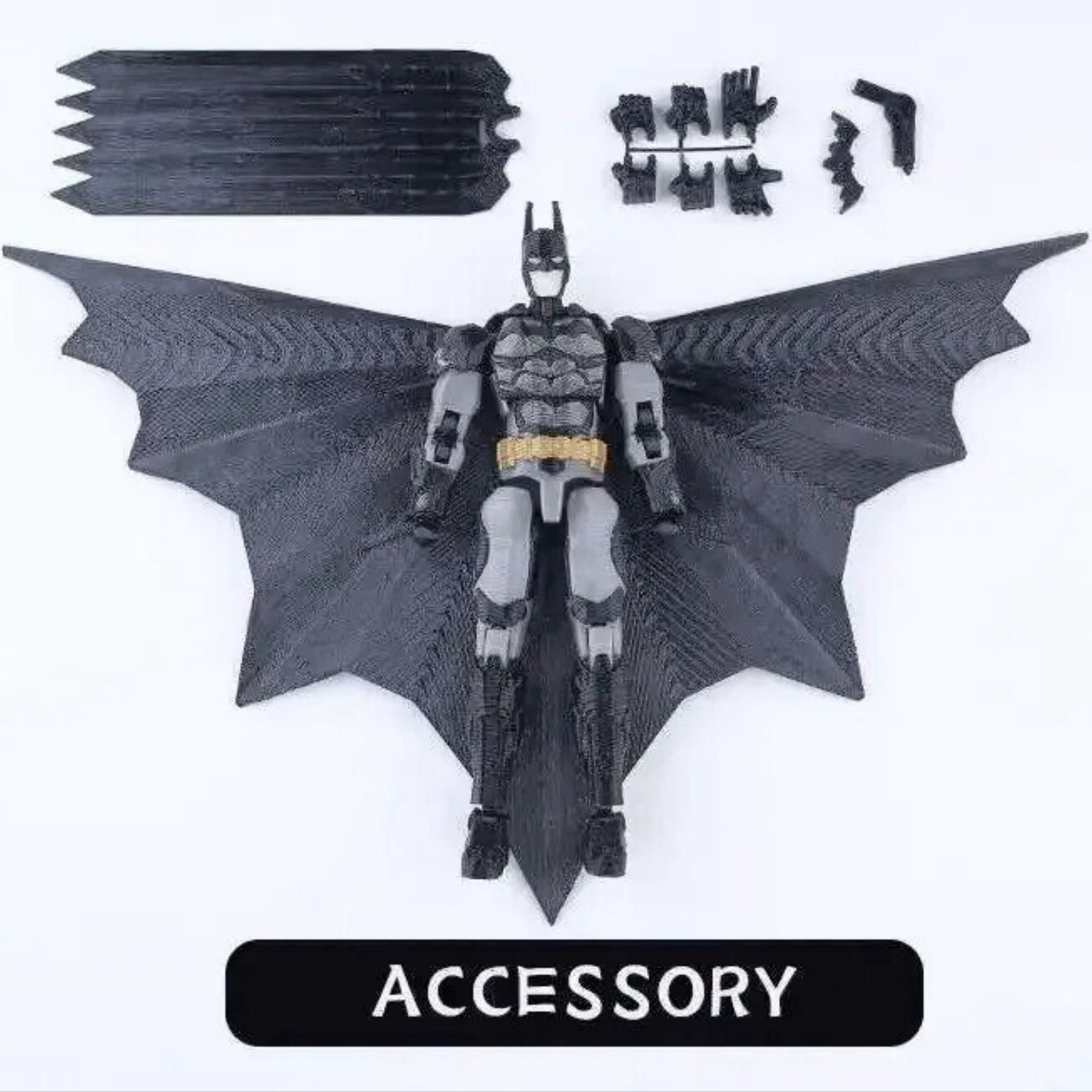 Batman action figure with large bat wings on a white background