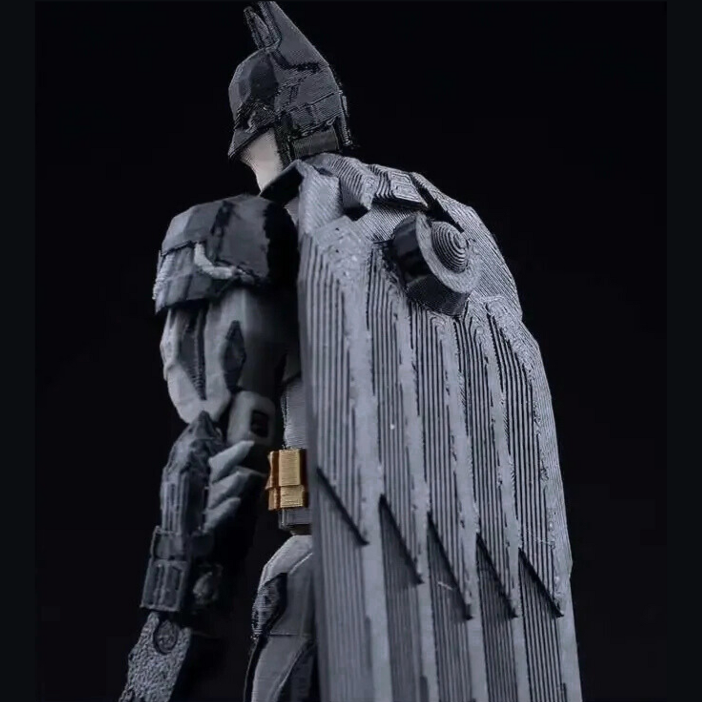 Detailed figurine of a warrior in armor against a black background