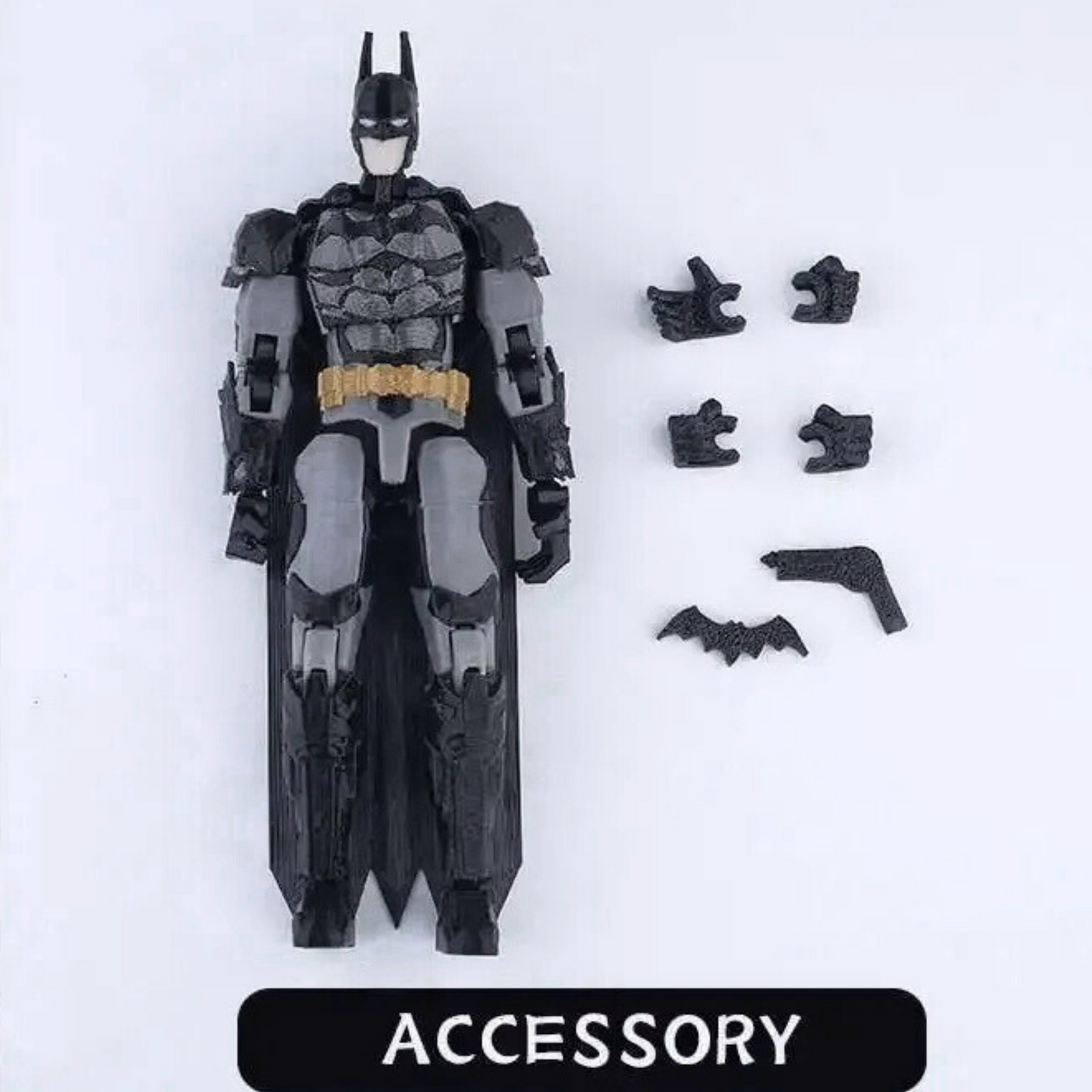 Toy figure of a superhero with various accessories on a white background