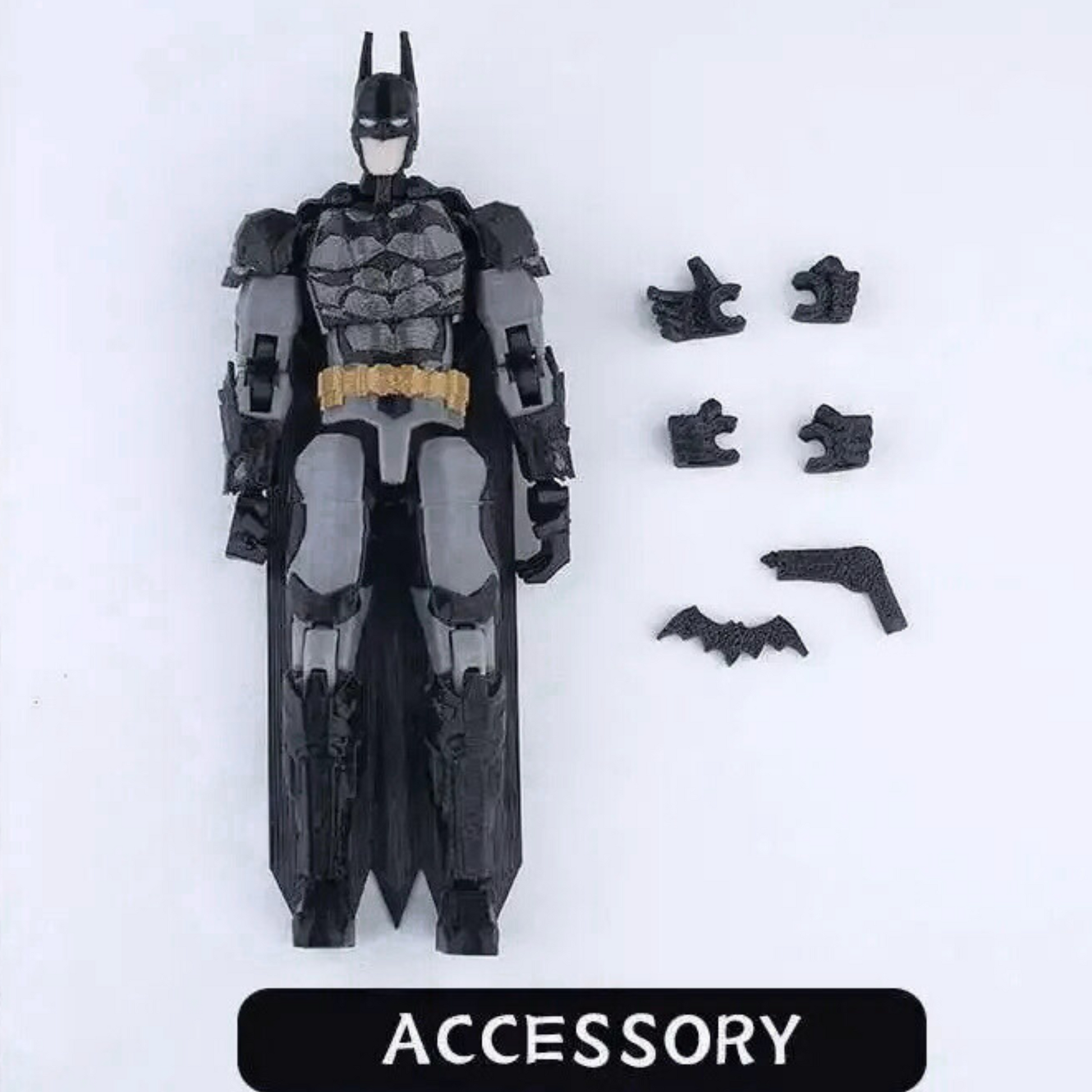 Toy figure of a superhero with various accessories on a white background
