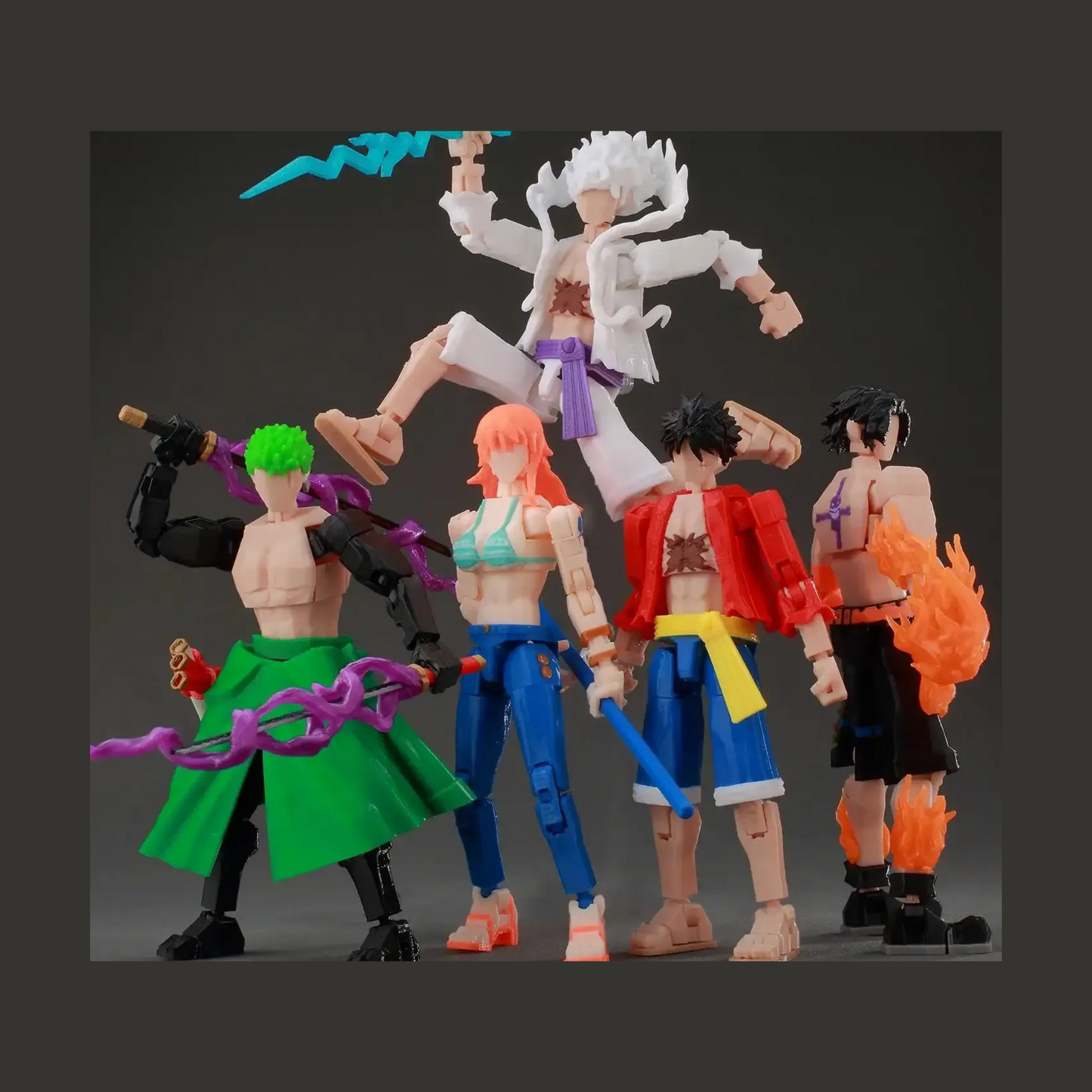 Five action figures with colorful outfits and accessories on a dark background