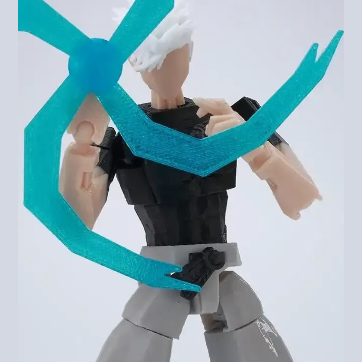 Toy figure with teal limbs on a white background