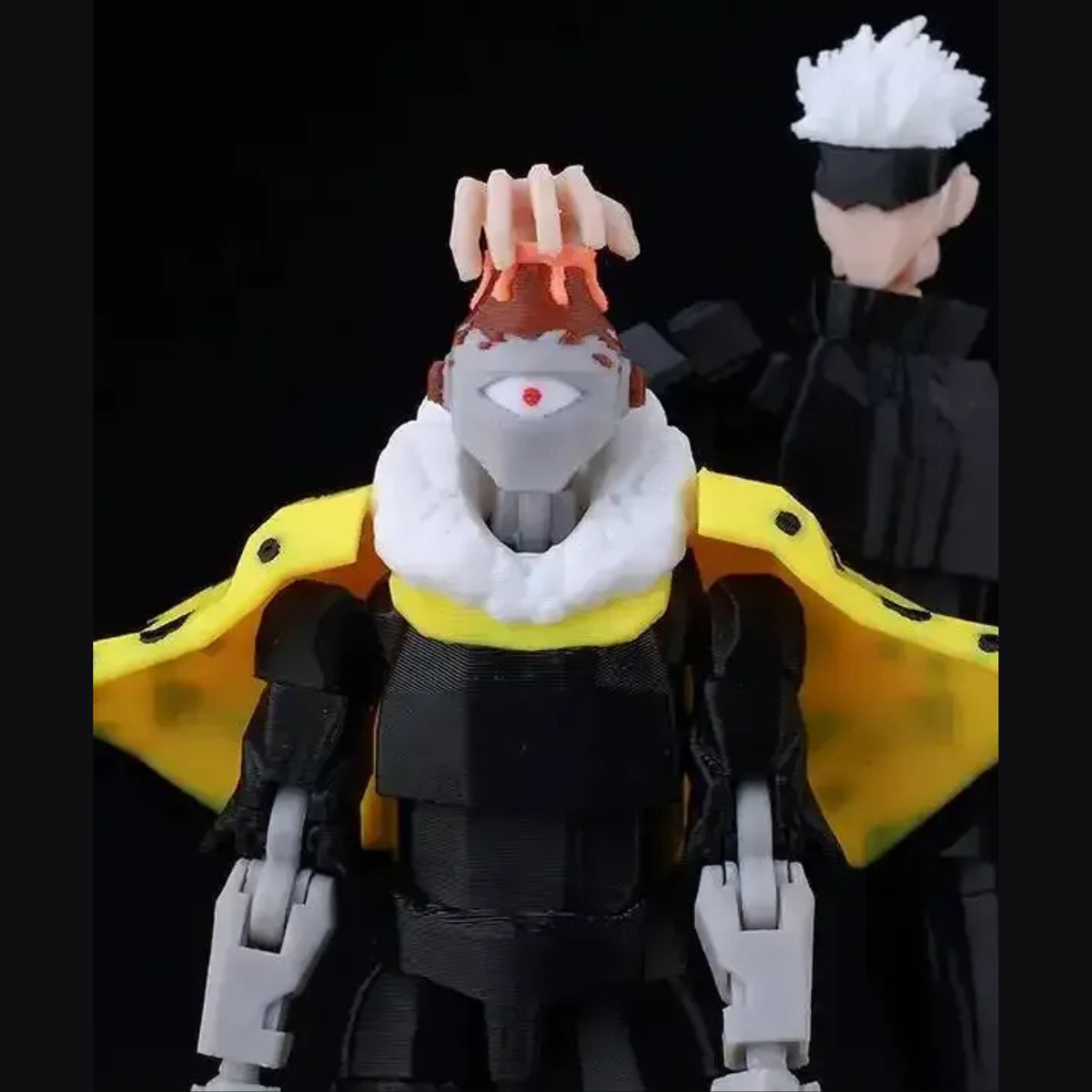Action figure with a yellow cape and white hair, standing against a black background