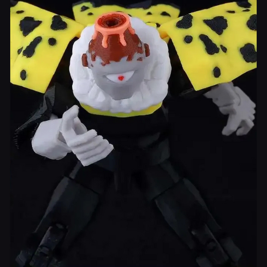 Toy figure with a black outfit, white gloves, and a yellow bow tie with black spots on a dark background.