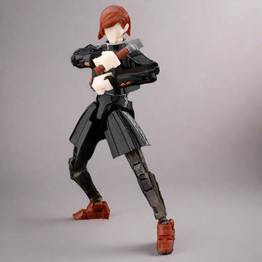 Action figure with red hair and black outfit holding a weapon on a dark background