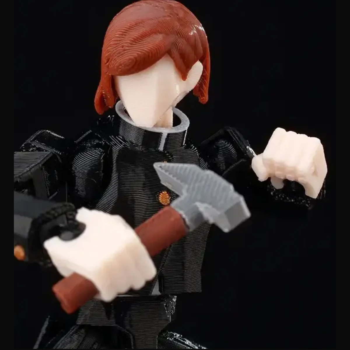 Action figure with red hair and black outfit holding a hammer against a black background