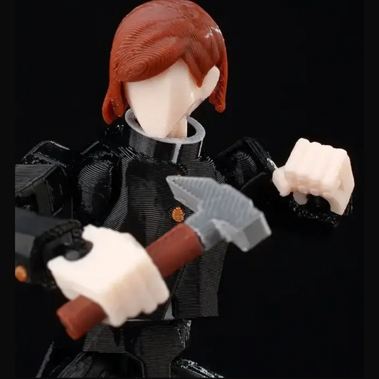 Action figure with red hair and black outfit holding a hammer against a black background