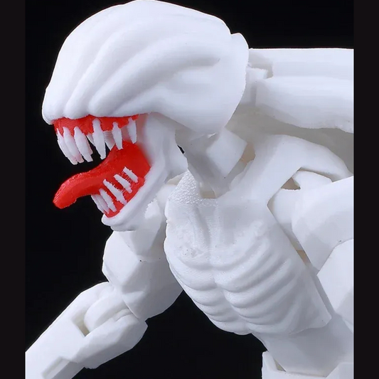 White and red creature figure with open mouth on a black background