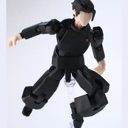 Black robot toy figure on a white background
