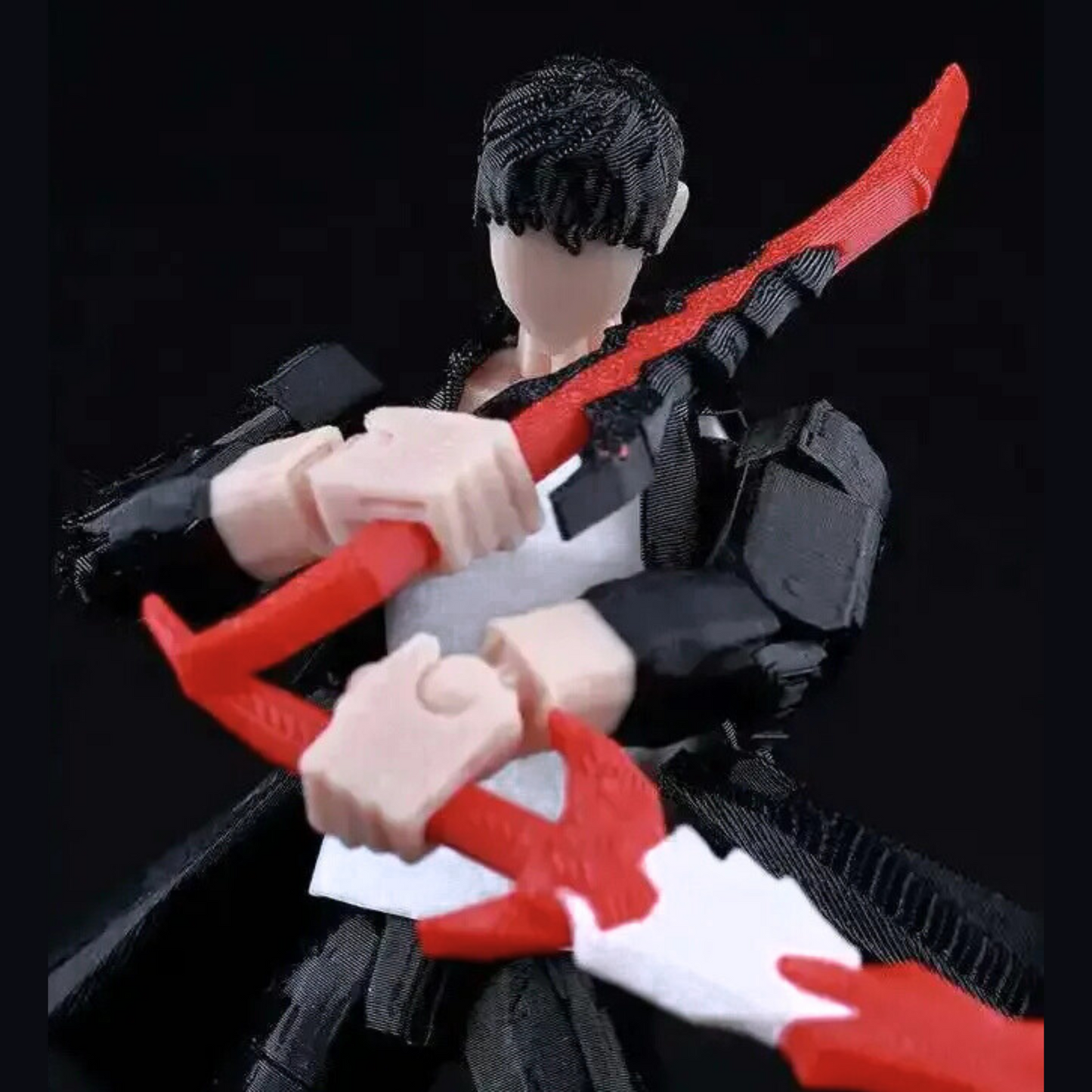 Action figure with red and black weapons on a black background