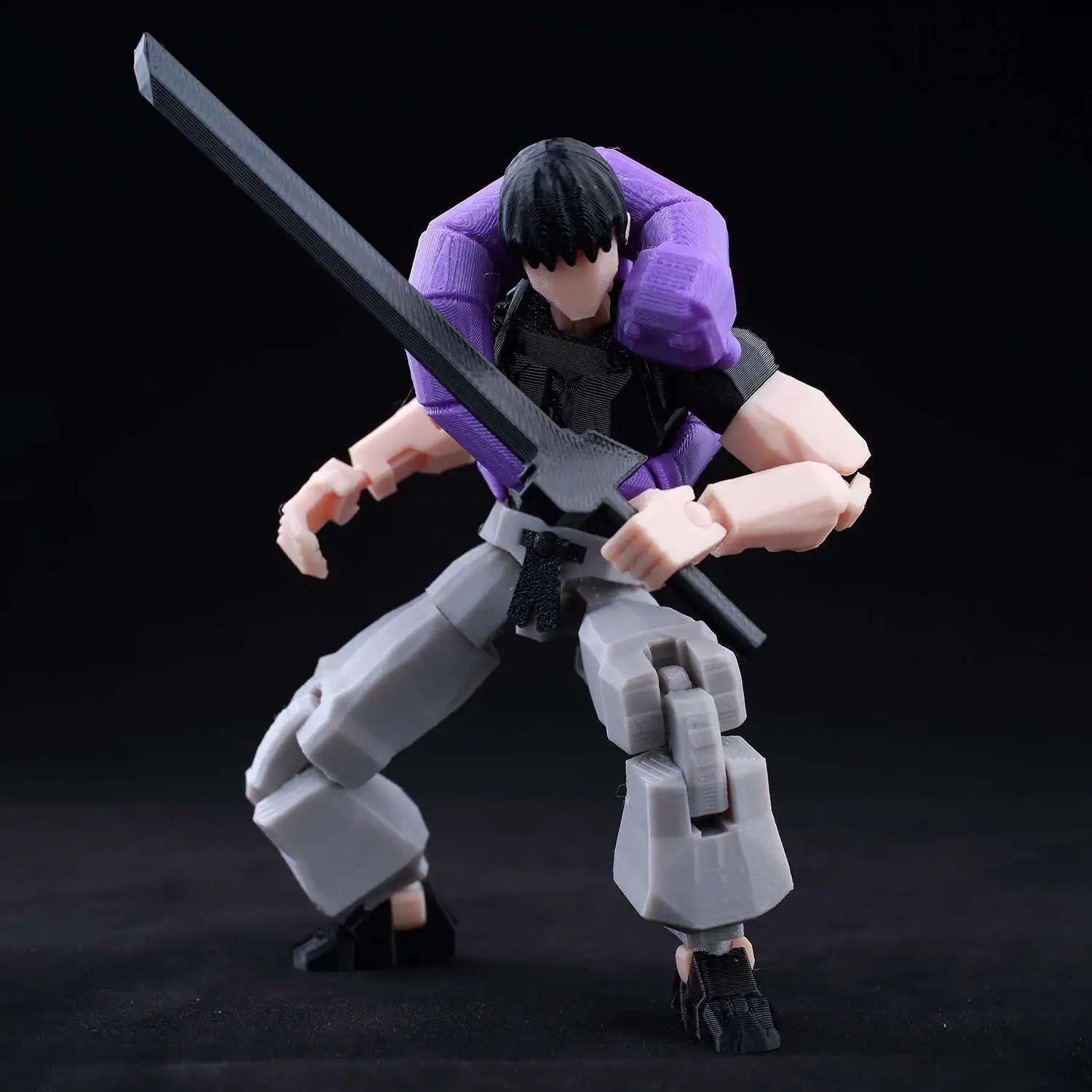 Action figure with a sword on a black background