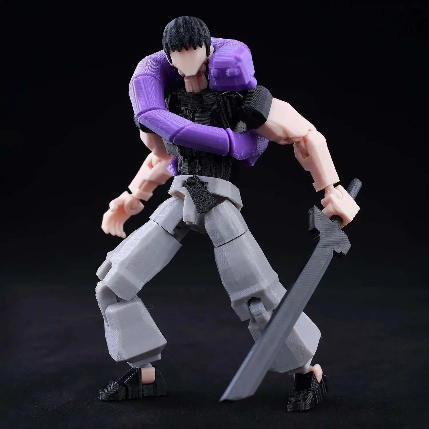 Action figure with purple arm gauntlets and gray legs on a black background