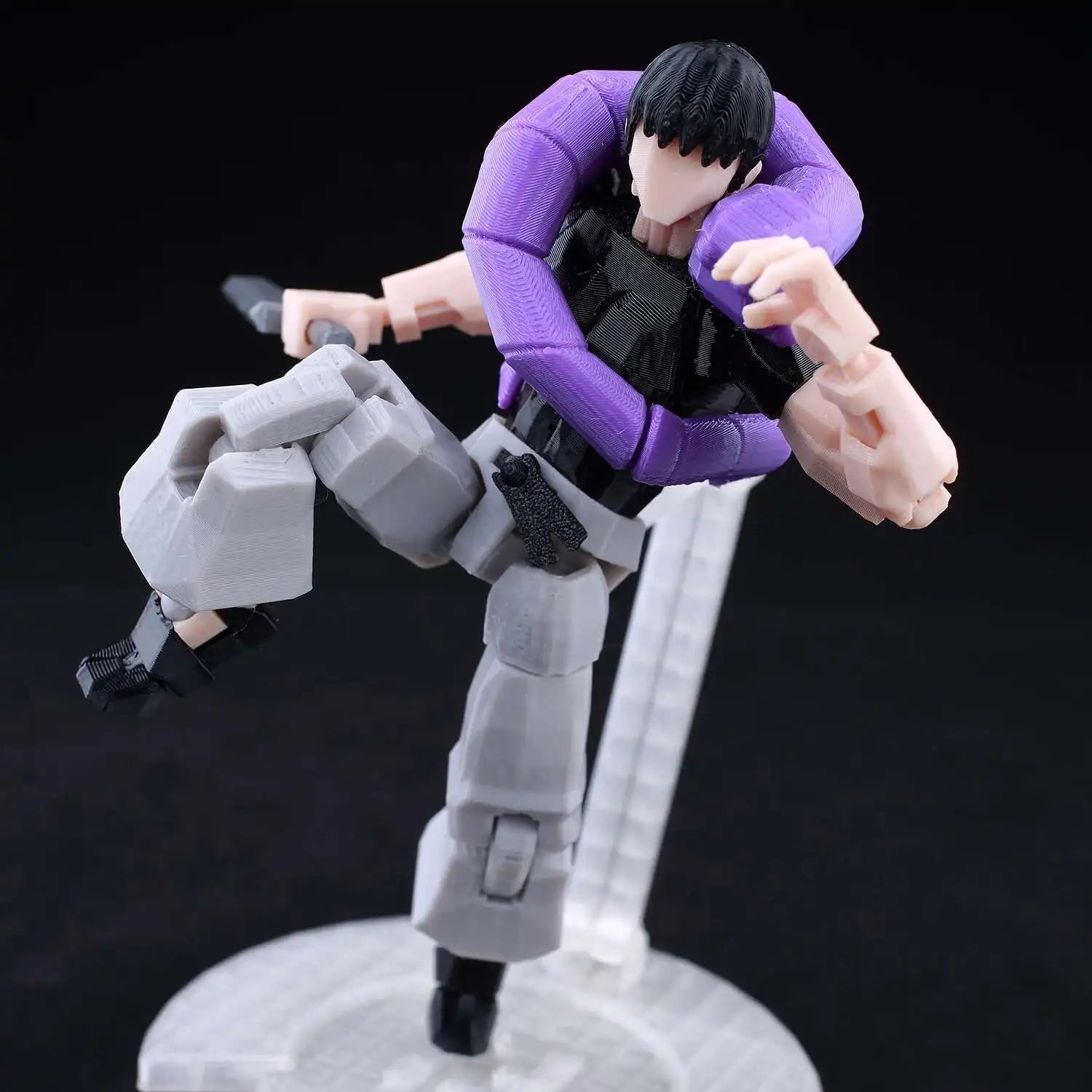Action figure with purple and gray armor on a black background