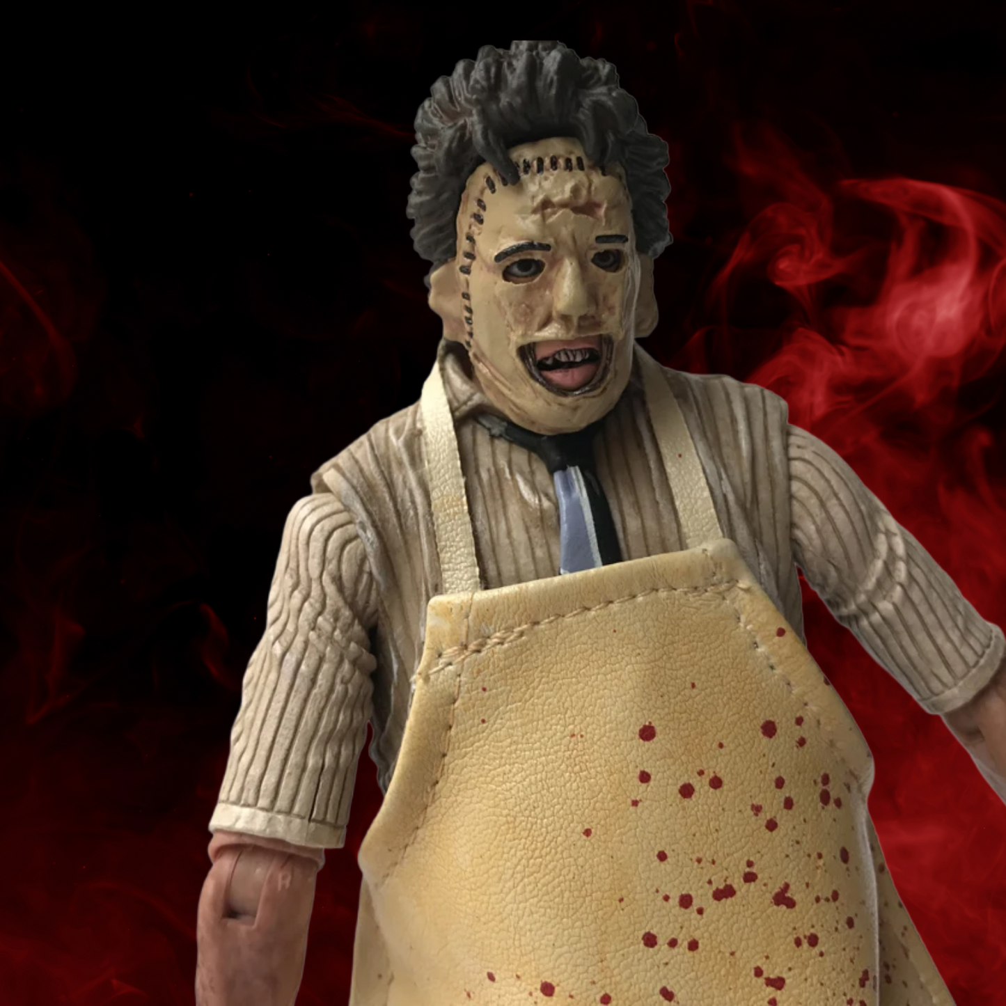 Action figure with a bloody apron against a dark background