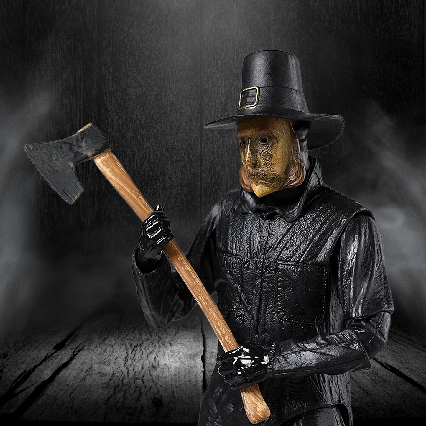 Person wearing a wooden mask and black outfit holding an axe against a dark background