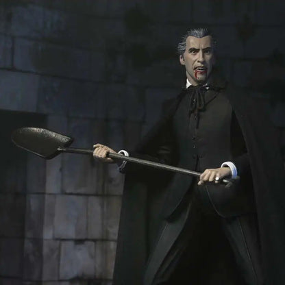 Vampire figurine holding a spoon against a stone wall background