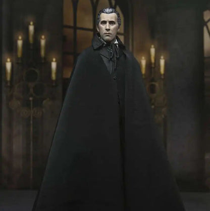 Figure in a dark cloak standing in a gothic-style room with candles.
