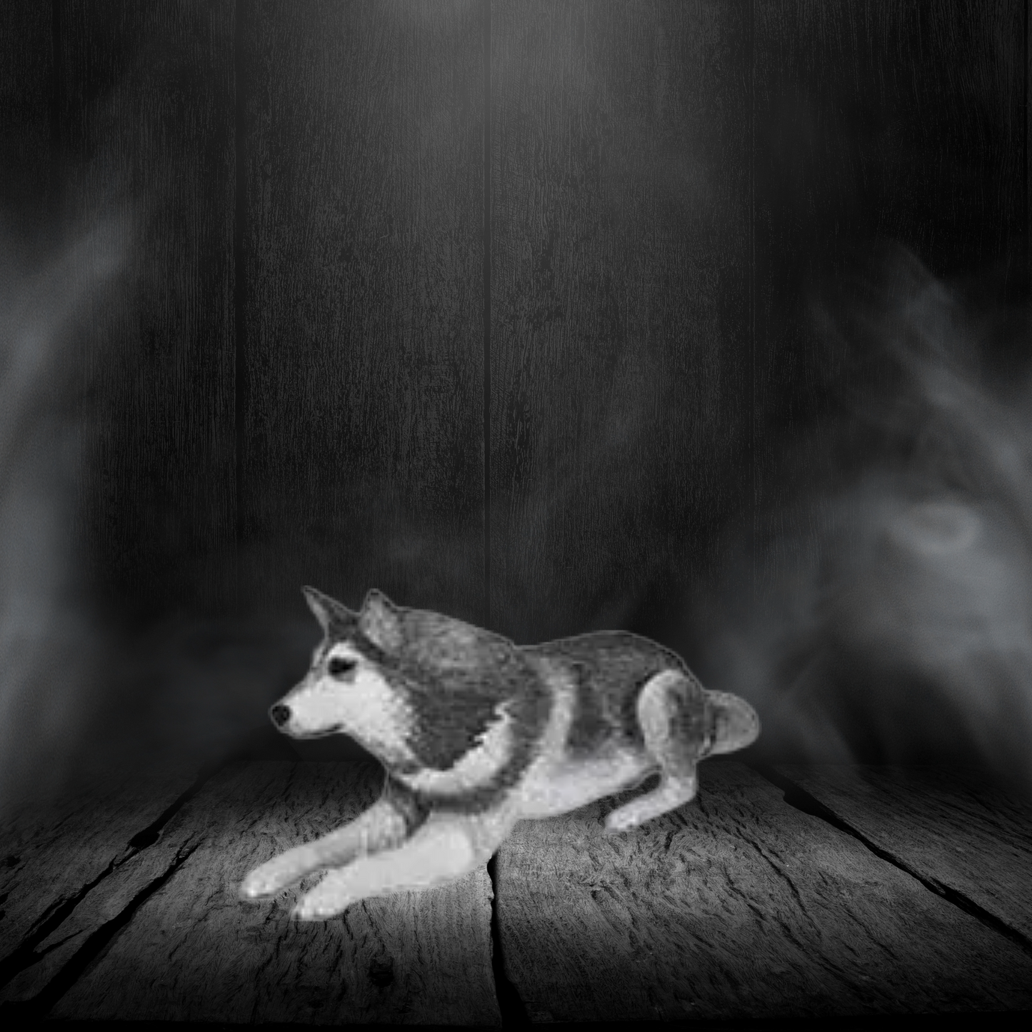 Black and white dog figurine on a wooden surface with a dark background