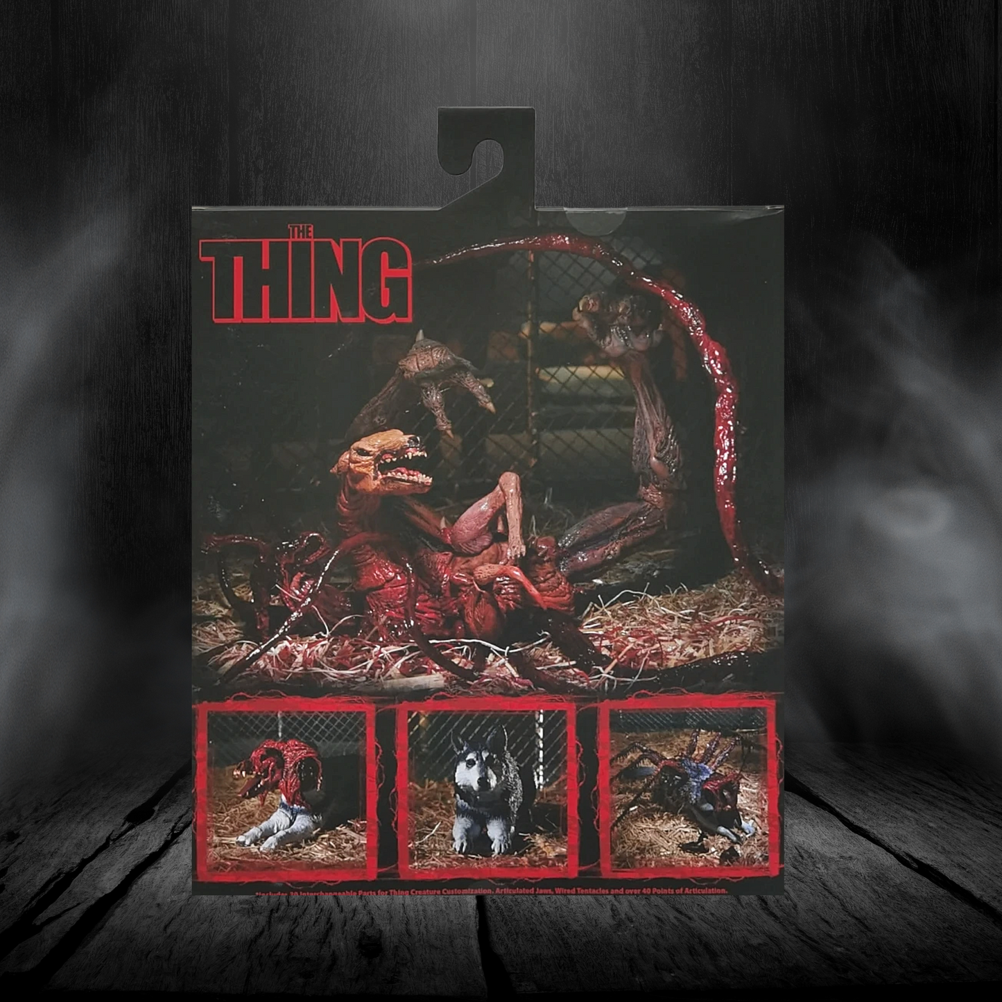 Toy figure packaging for 'The Thing' with a dark, smoky background
